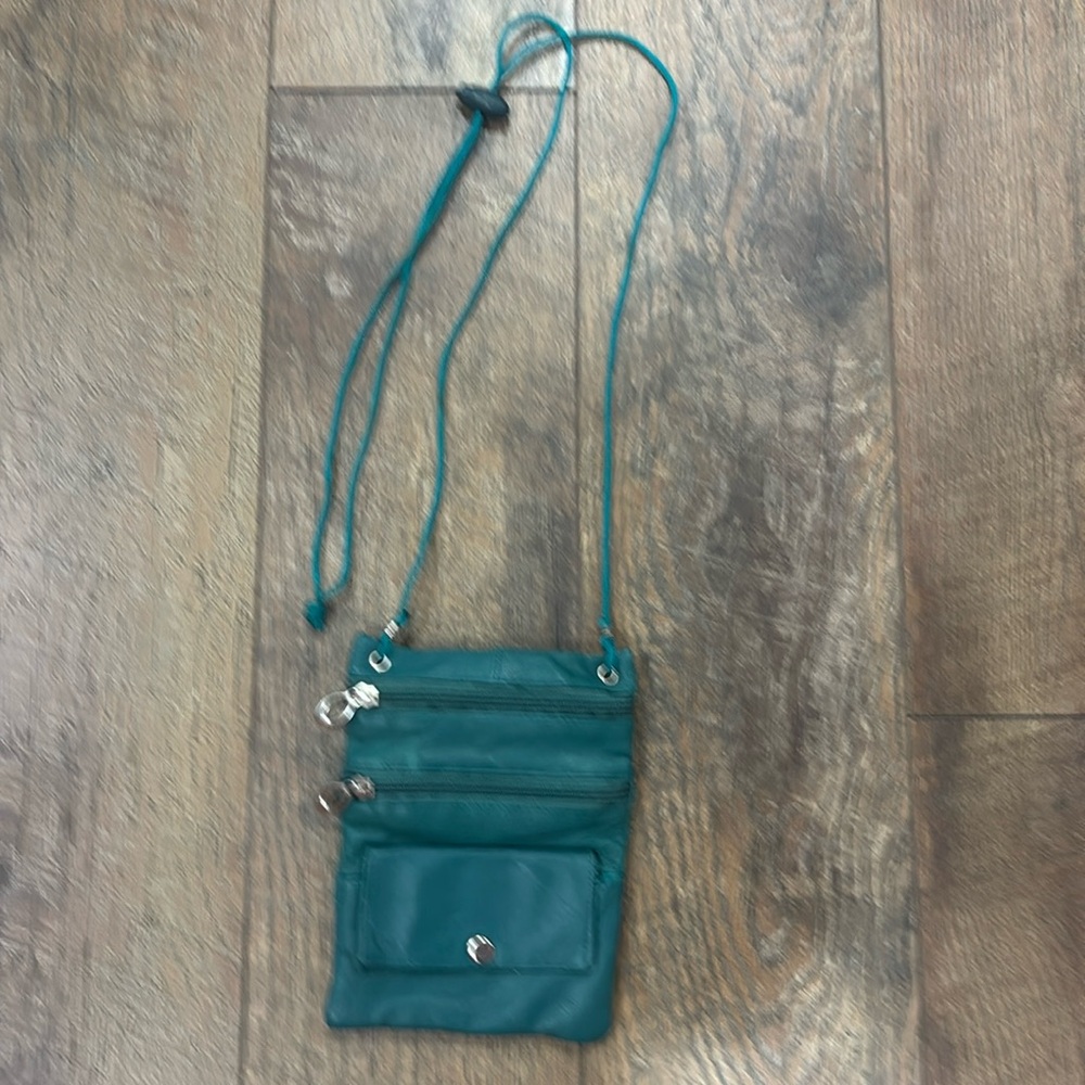 Green faux leather adjustable crossbody purse.